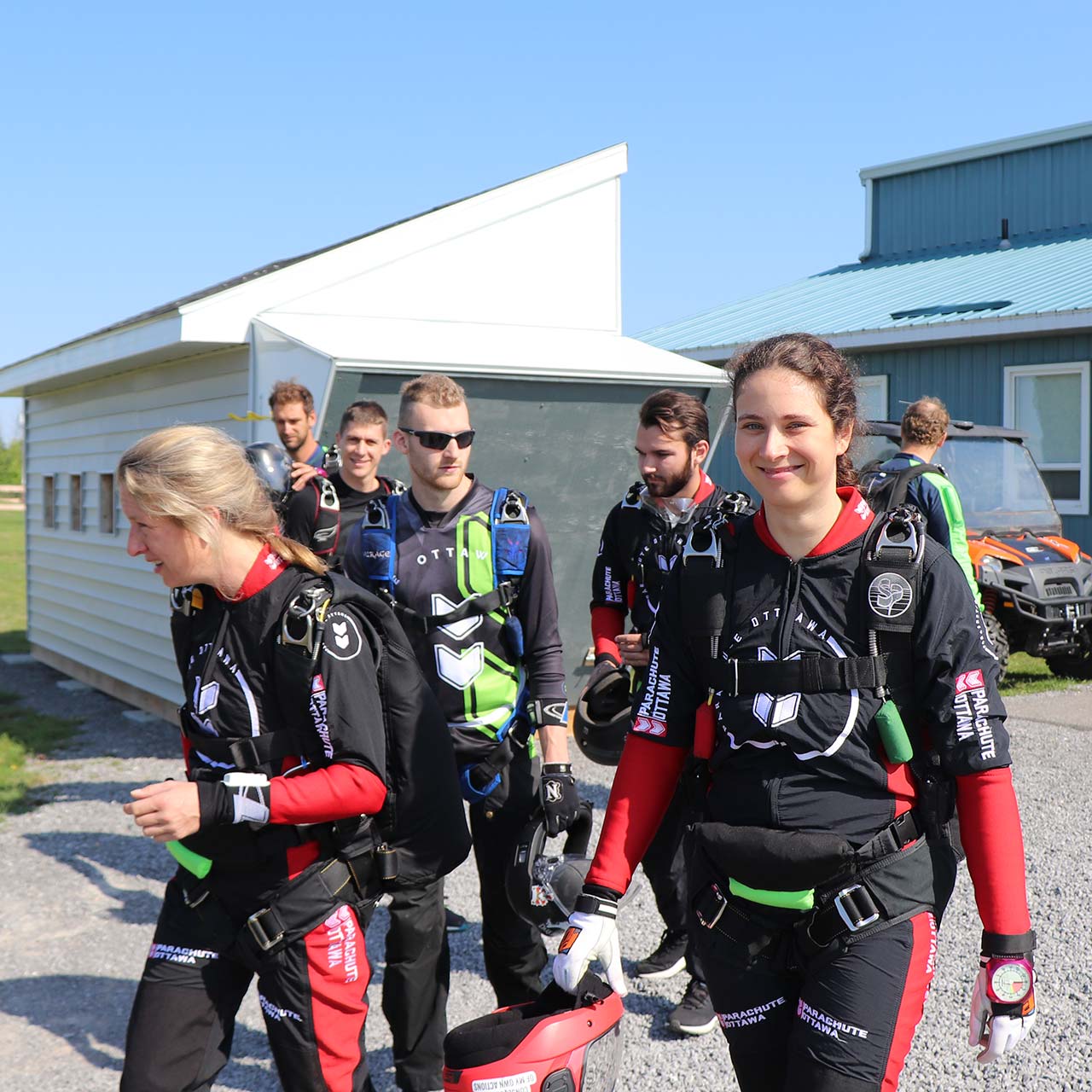 Skydivers walking to board the aircraft at Parachute Ottawa skydiving centre