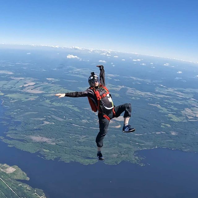 Licensed skydiver in freefall over Parachute Ottawa in Canada