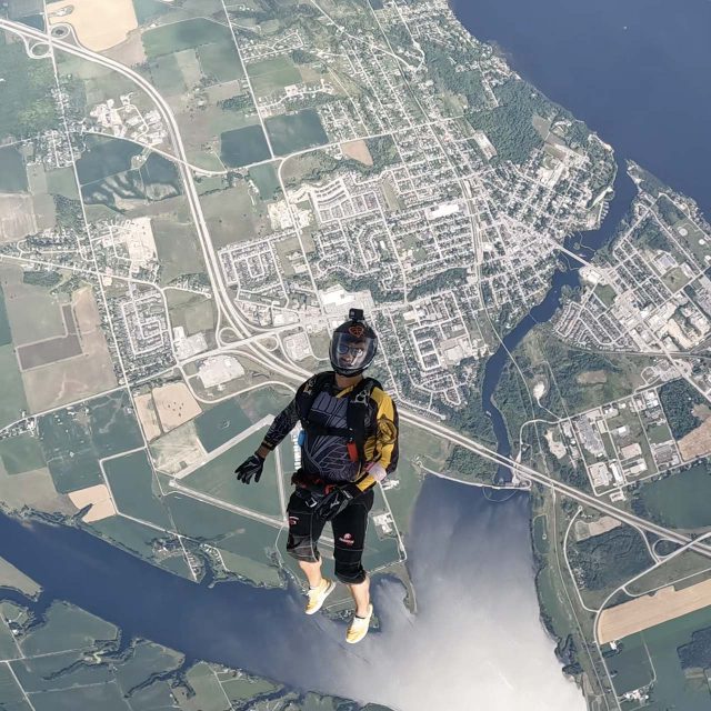 Licensed skydiver in freefall over Parachute Ottawa in Canada