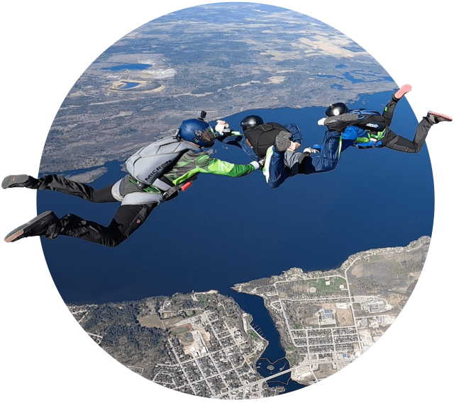 PFF skydiving student learning to skydive with two instructors at Parachute Ottawa in Ontario