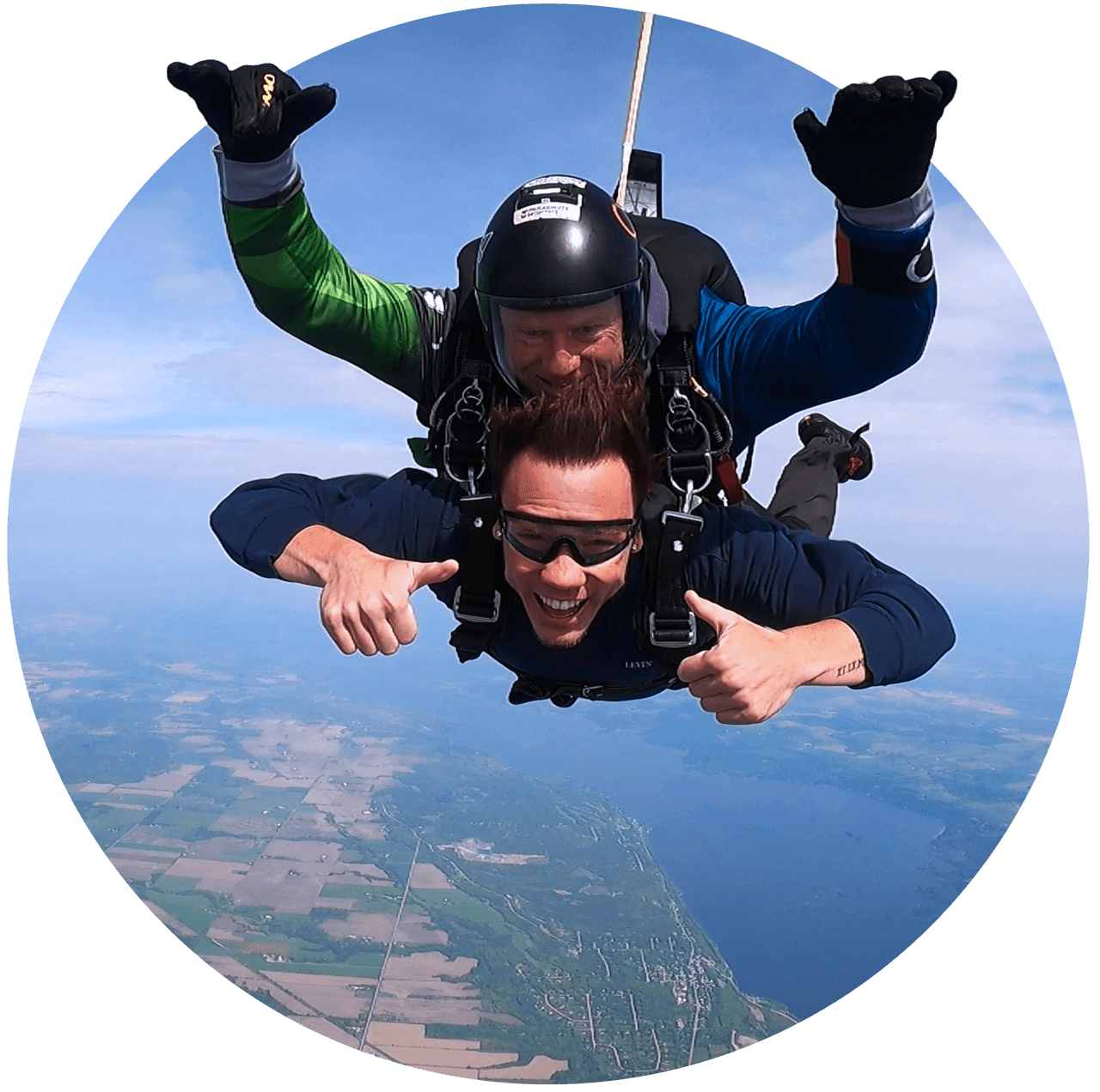 Tandem skydiving student and instructor in freefall over Parachute Ottawa in Ontario, Canada